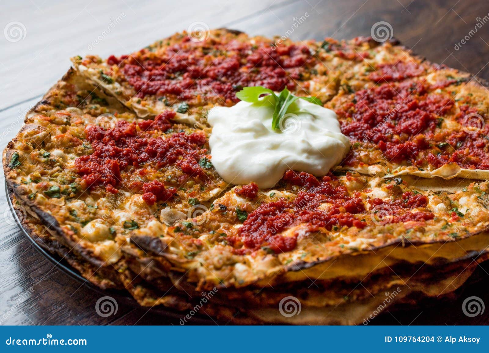 turkish food kayseri yaÃÅ¸lama with minced meat, yogurt and tomate paste.