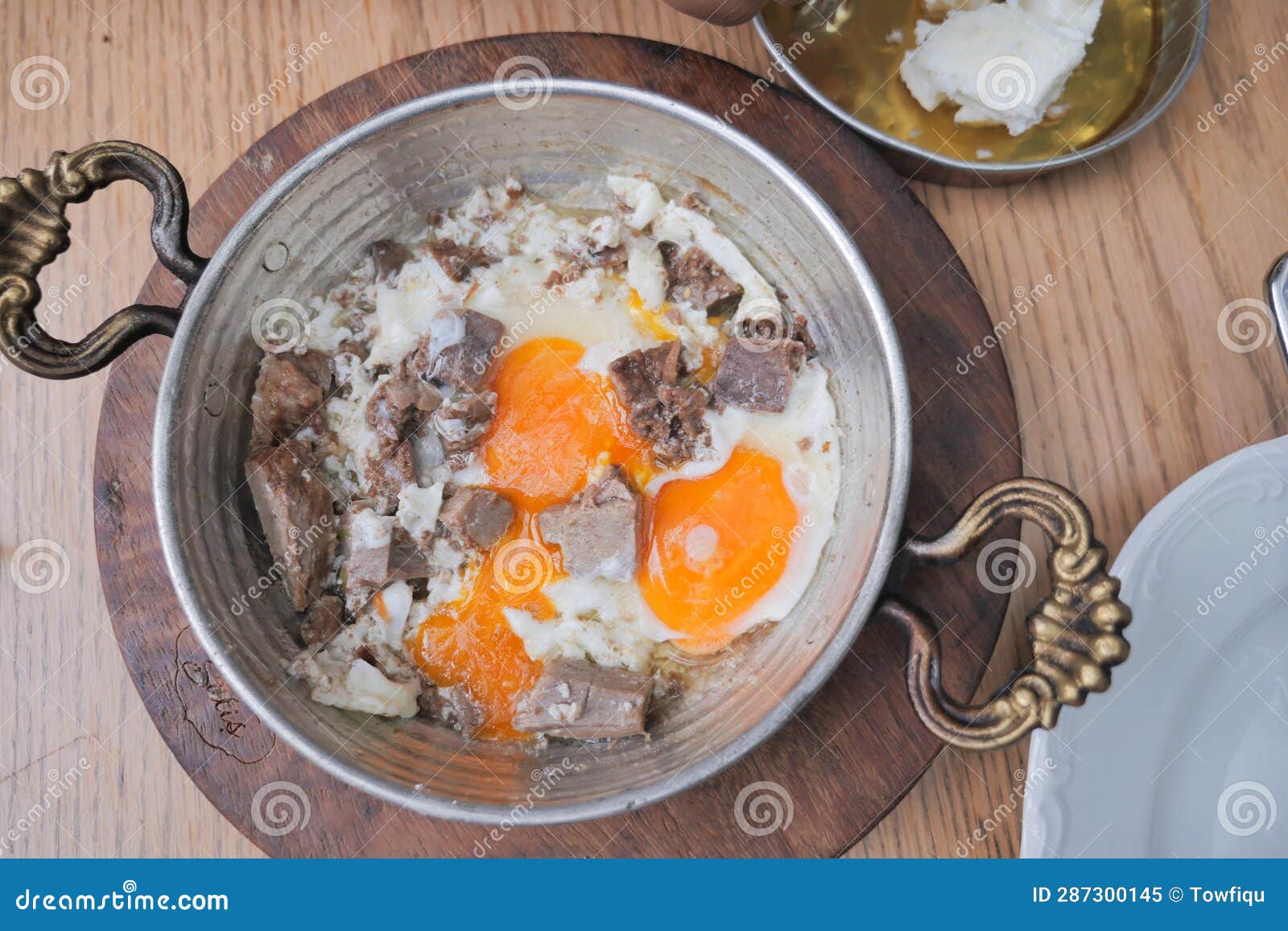 Turkish Scrambled Eggs with Roasted Meat in Copper Pan Stock Image