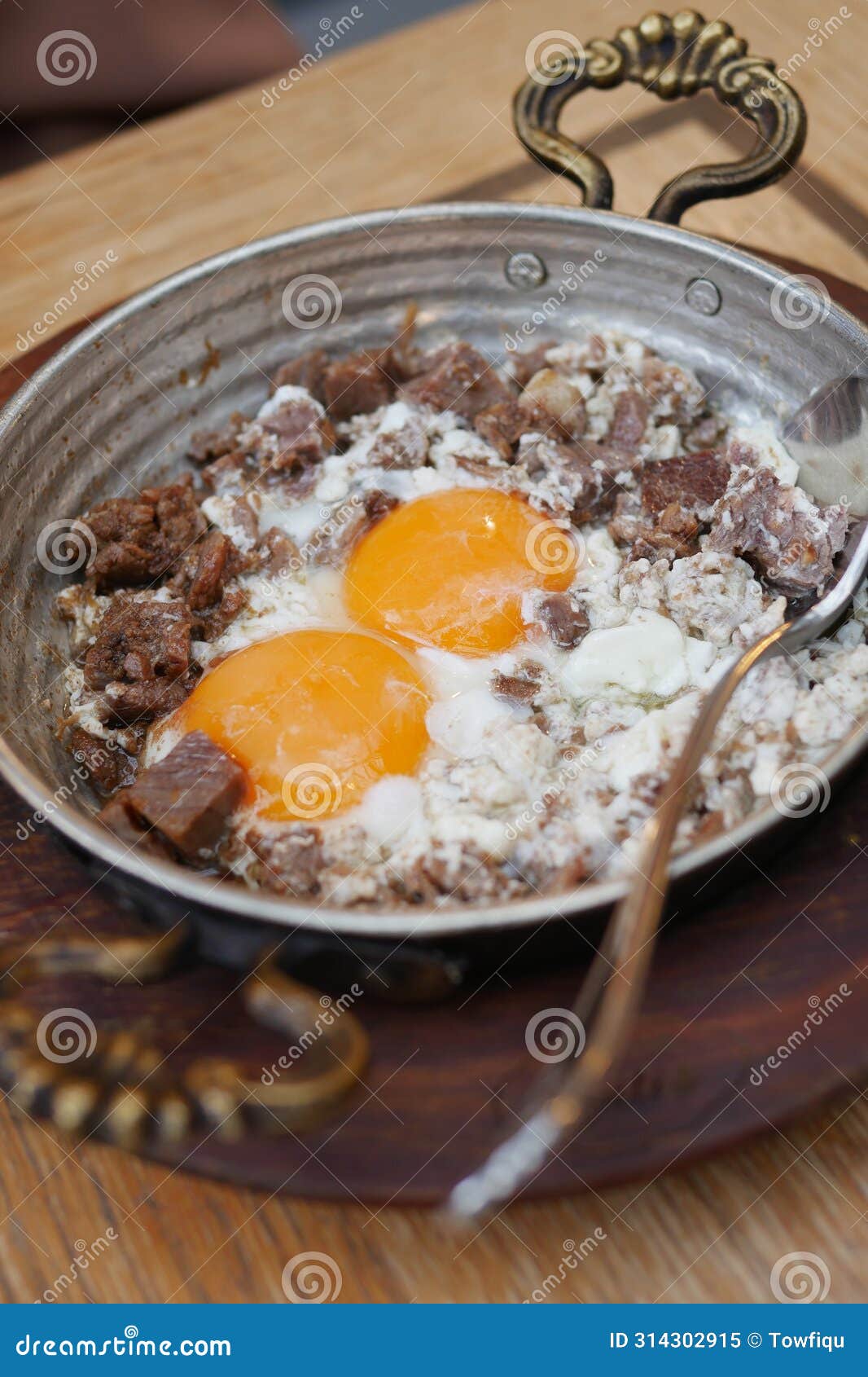 Turkish Scrambled Eggs with Roasted Meat in Copper Pan Stock Image