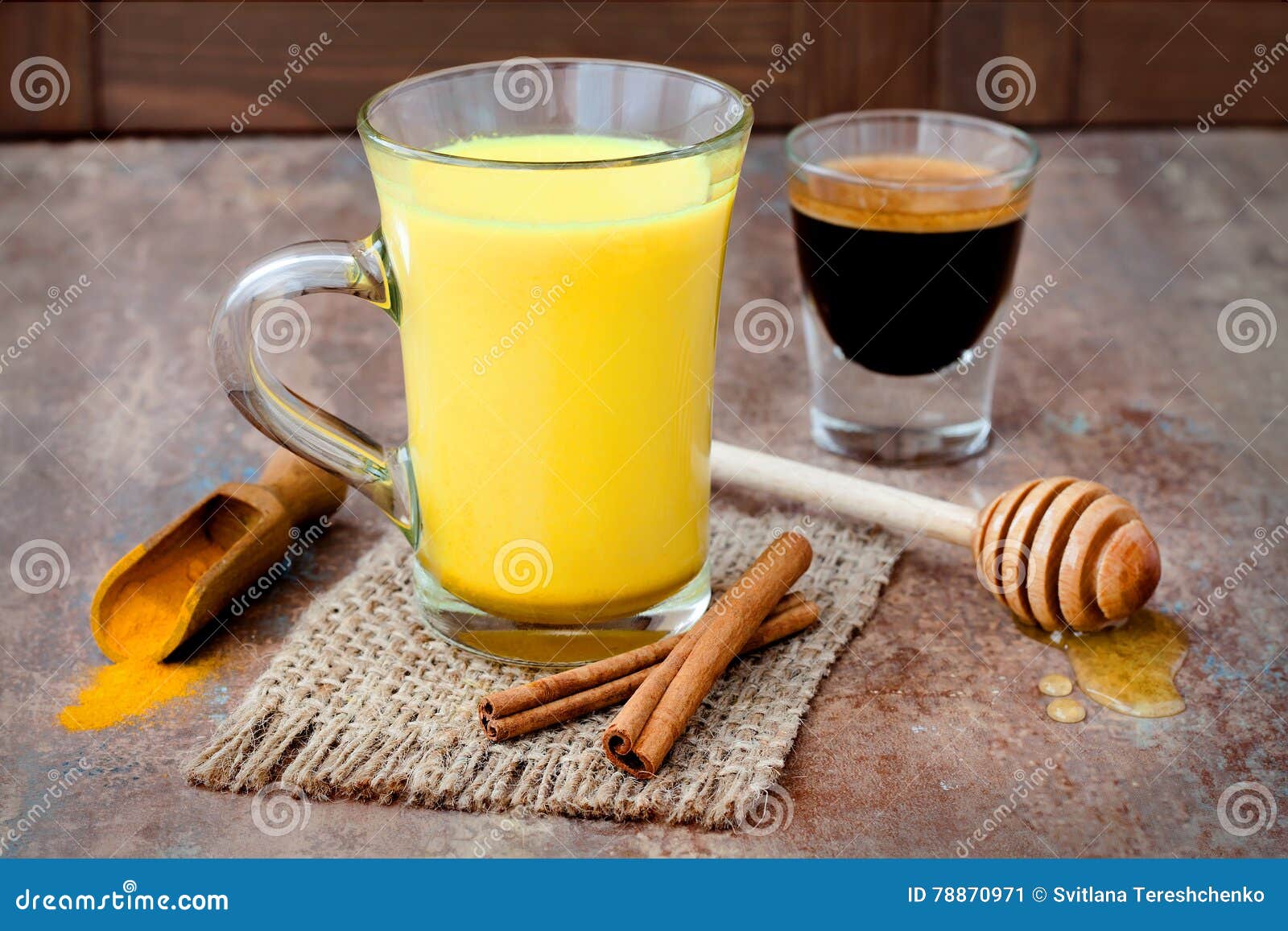 turmeric golden milk latte with cinnamon sticks and honey. detox liver fat burner, immune boosting, anti inflammatory drink