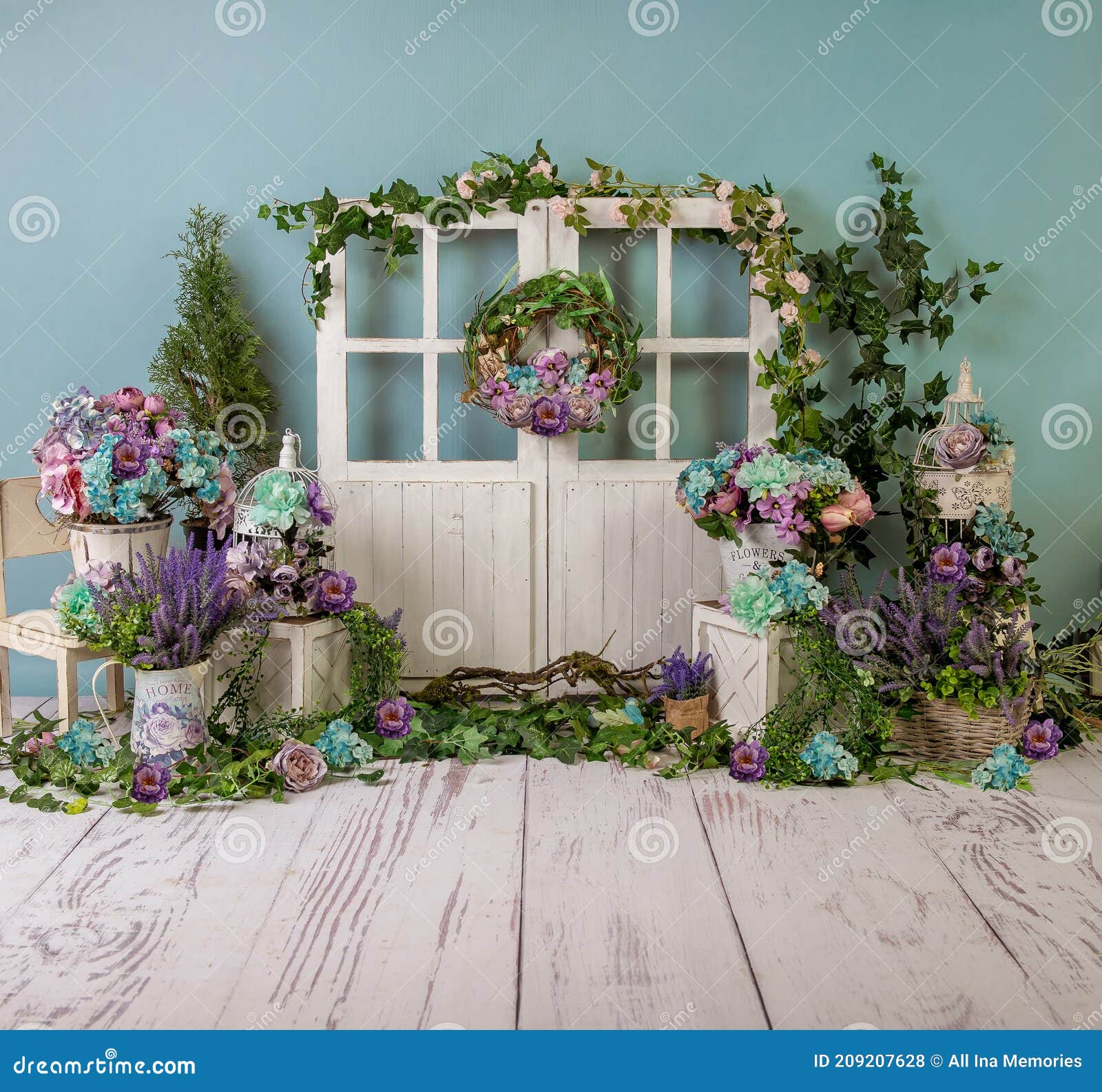 turqoise spring sett up with colourful flowers pink , purple, bleu, and turqoise  flowers, vintage wood parquet