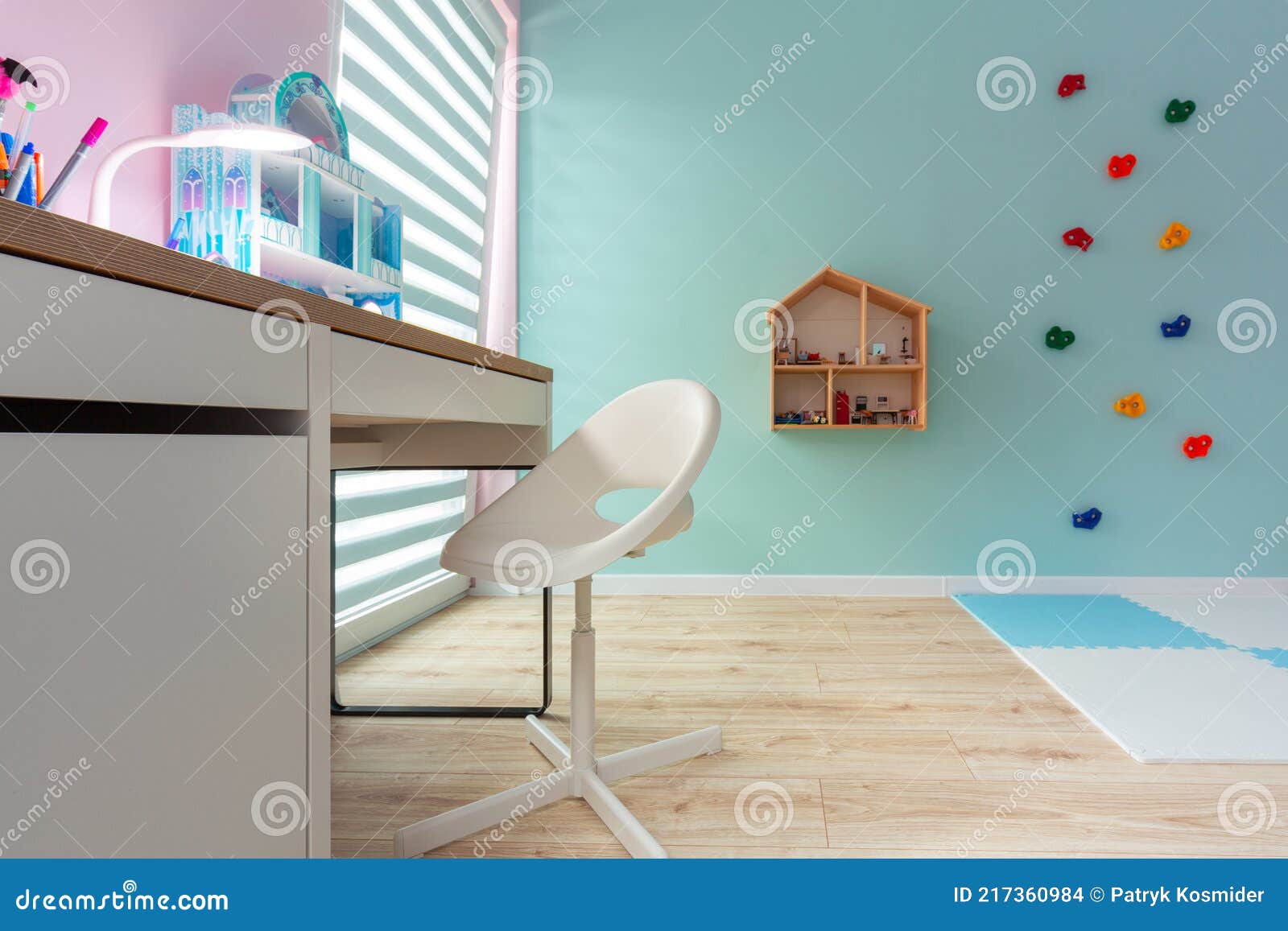 A Turquoise Playroom for Children with a Study Desk Stock Photo Image