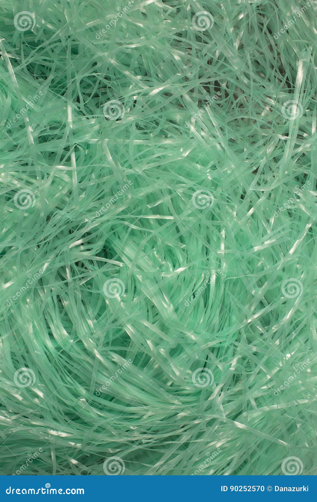 Turquoise Shredded Plastic Fake Easter Grass Background Stock Photo