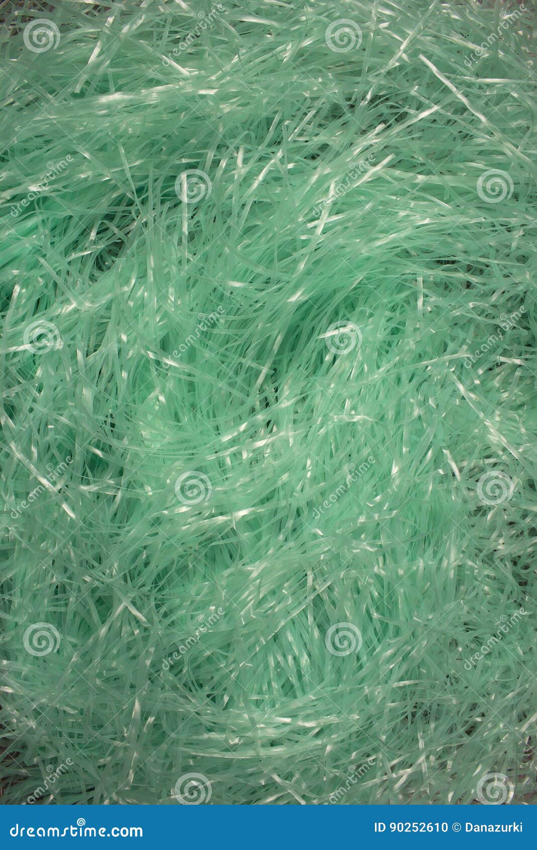 Turquoise Shredded Plastic Fake Easter Grass Background Stock Photo
