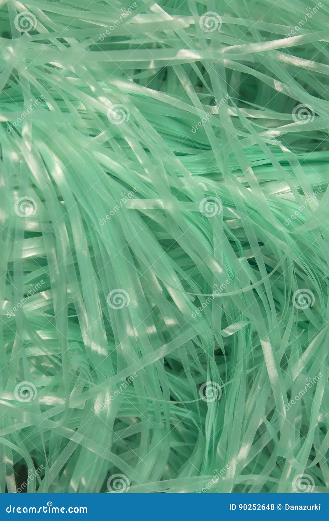 Turquoise Shredded Plastic Fake Easter Grass Background Stock Photo