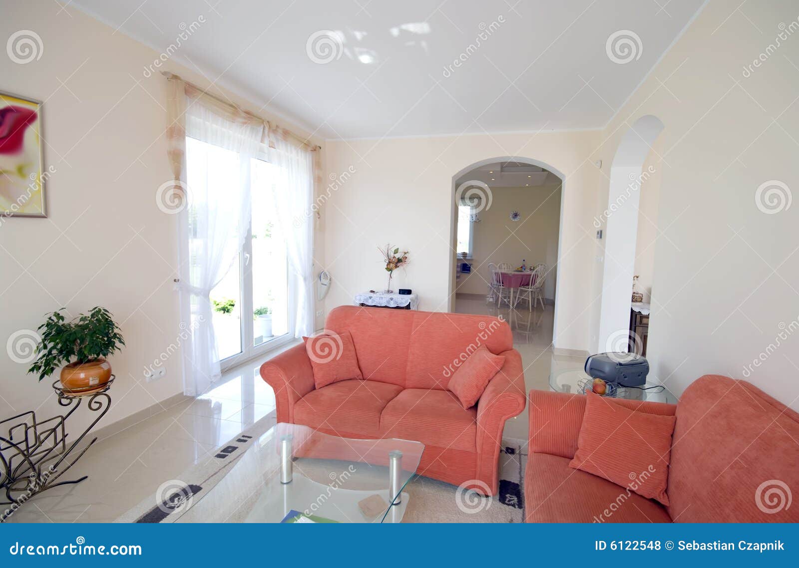 tv room with orange sofas