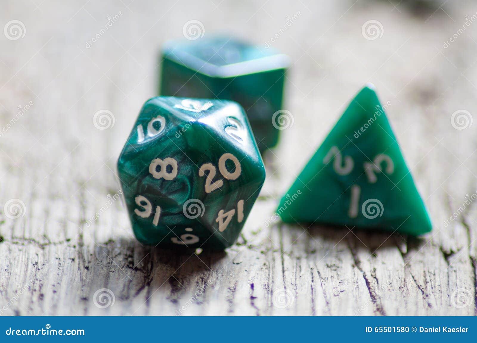 D20 Twentysided Black Metallic Die Dice On Foam Background In Bright