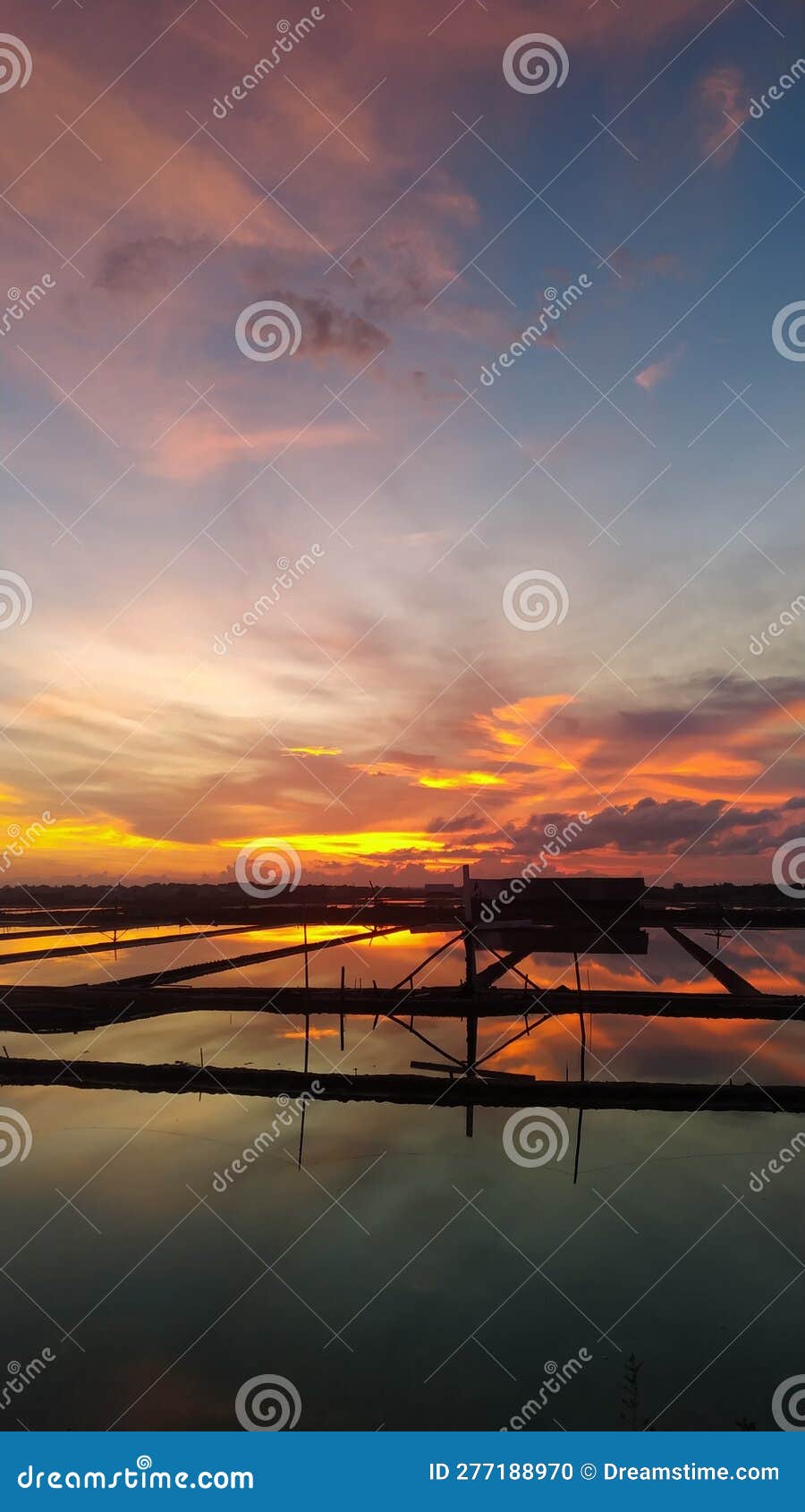 Twilight Atmosphere of Salt Ponds in a Small Town Stock Photo Image