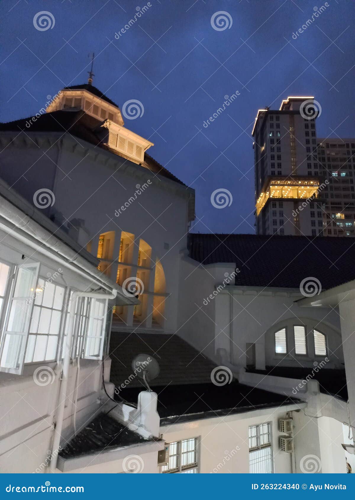 twilight and old buildings among new ones