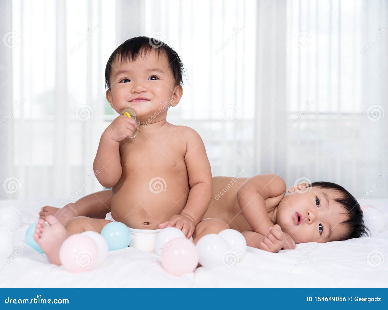 Twin babies on a bed stock photo. Image of happy, caucasian 154649056
