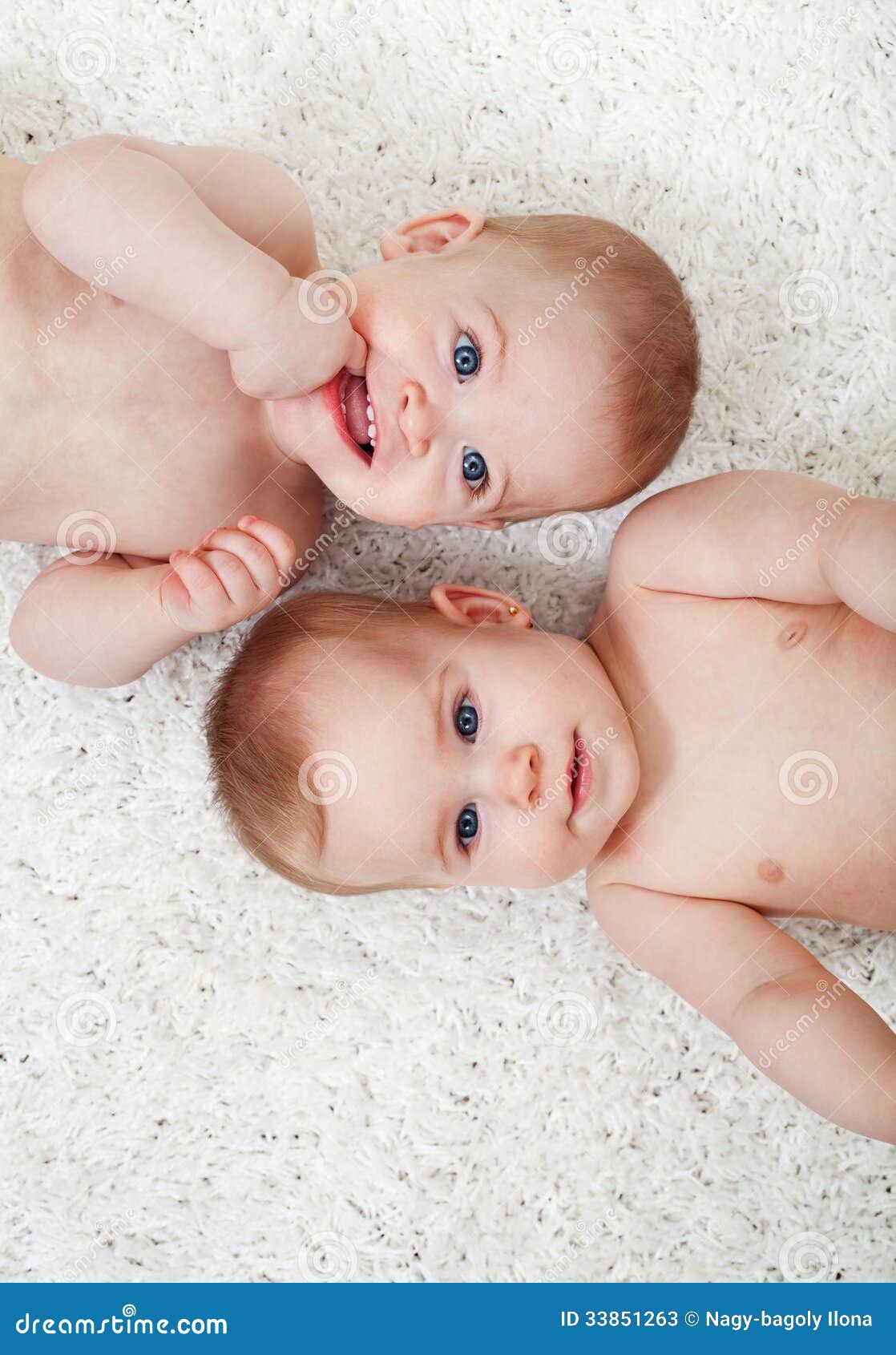 Twin Babies Laying on the Floor Stock Image Image of chewing, little