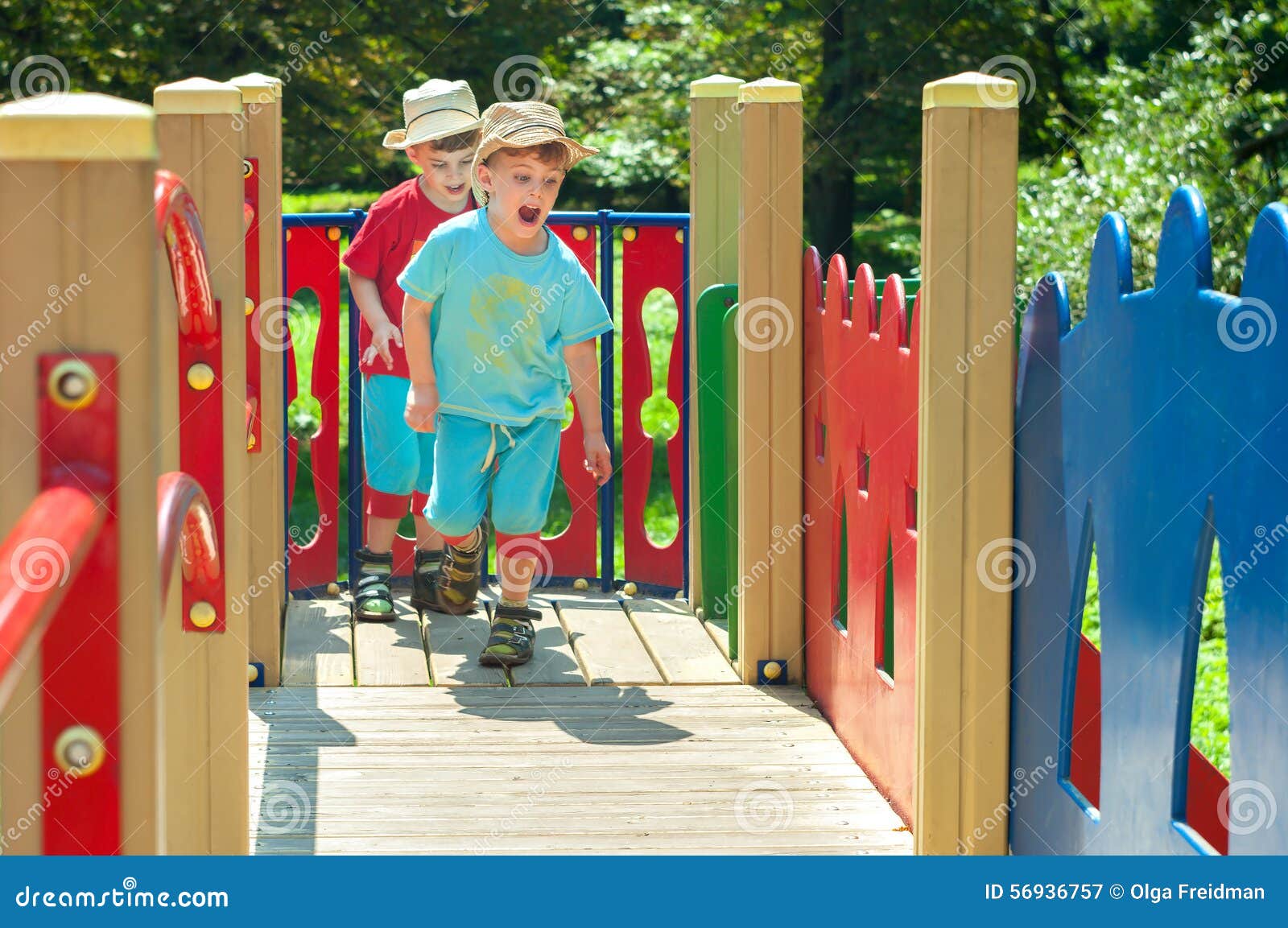 twin brothers play catch-up on the playground