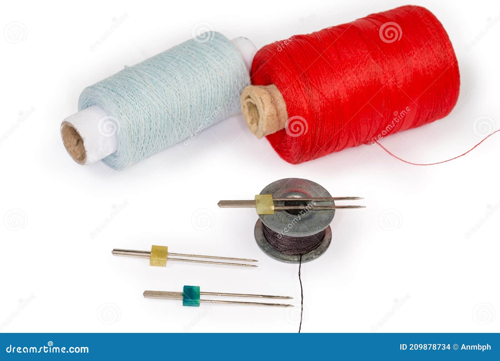 Twin Sewing Machine Needles and Bobbin Against the Threads Spools Stock