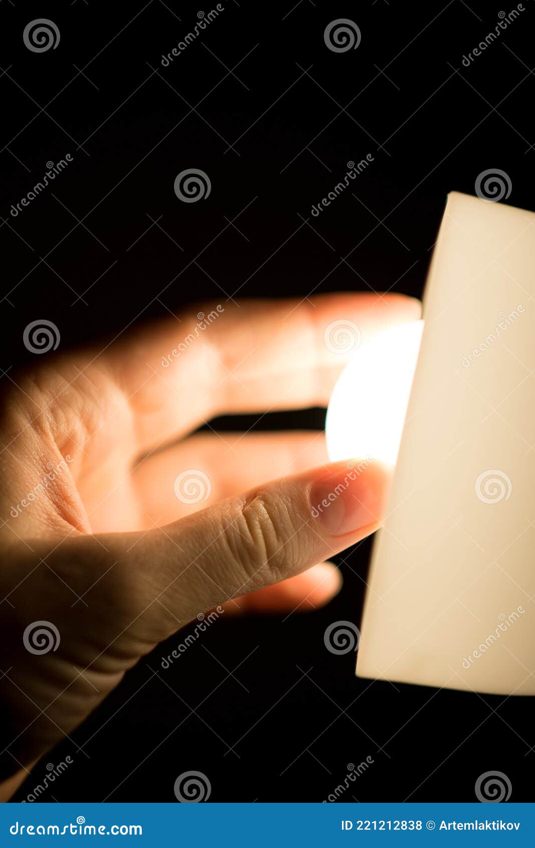 Twisting the Lamp. Turning on the Lights Stock Photo Image of