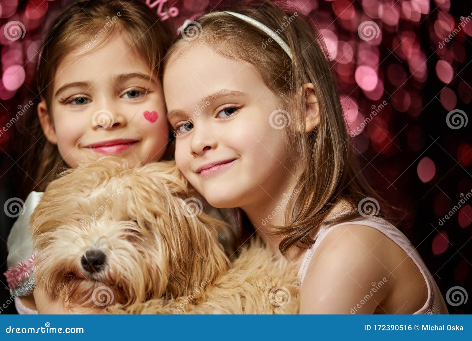 Two Adorable Little Girls with Dog are Posing on the Shiny Background ...