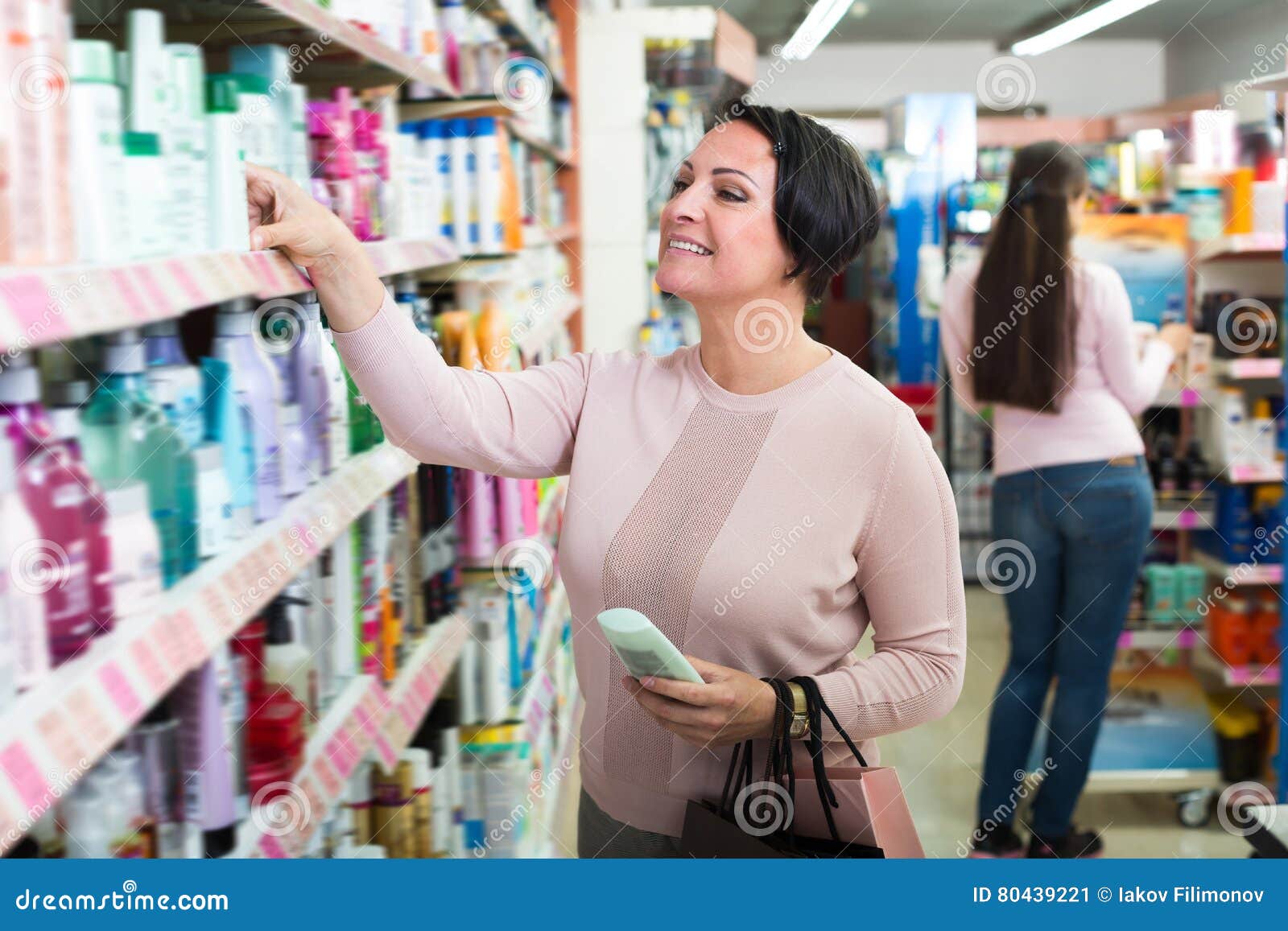 Two Adult Women Picking Cream From Shelf Stock Image Image Of Adult Advice 80439221