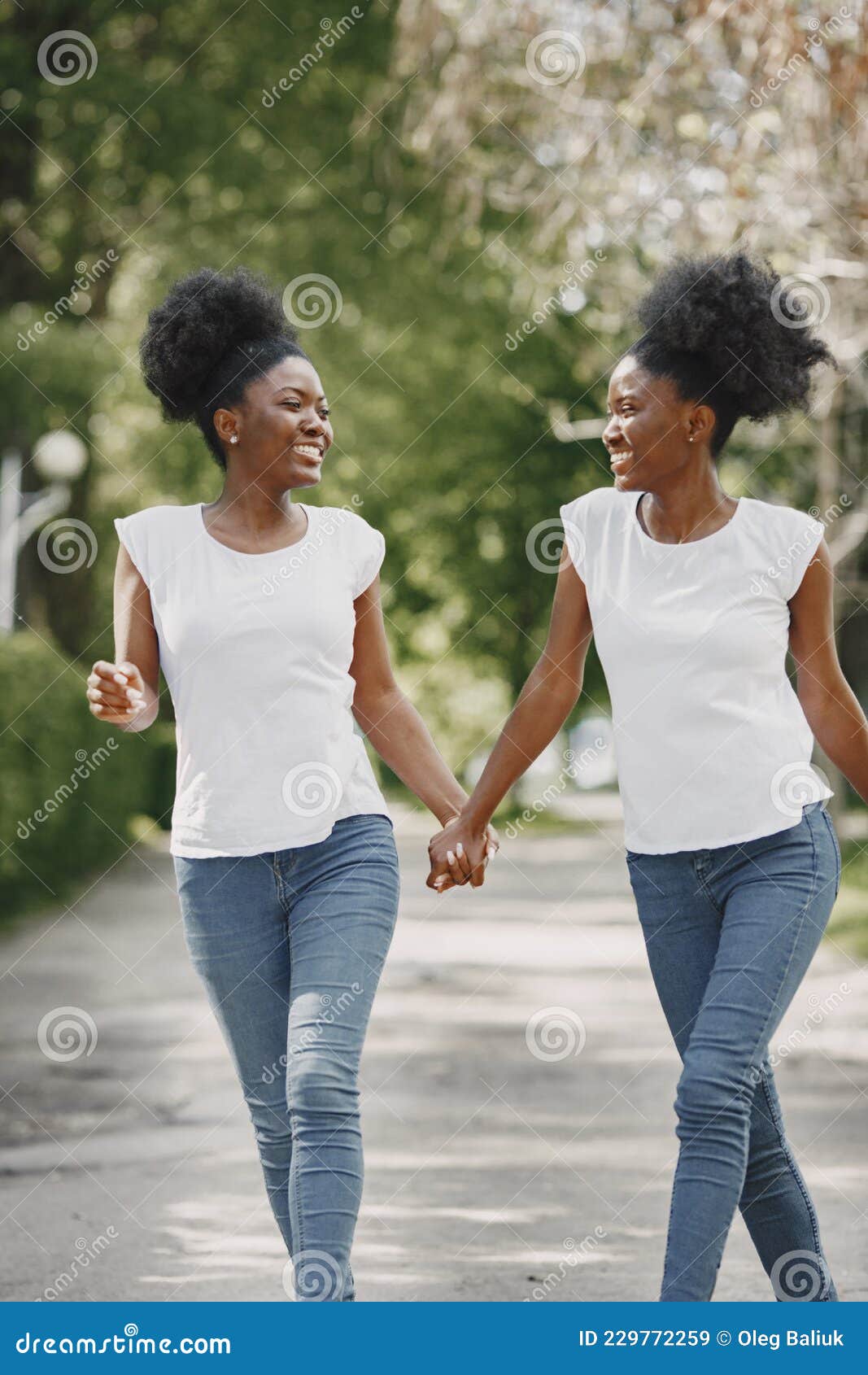 Close Up Portrait Of Two Teen Girls Holding Hands.African Teen Standing On  Beach With Caucasian Friend. Stock Photo, Picture and Royalty Free Image.  Image 61355887.