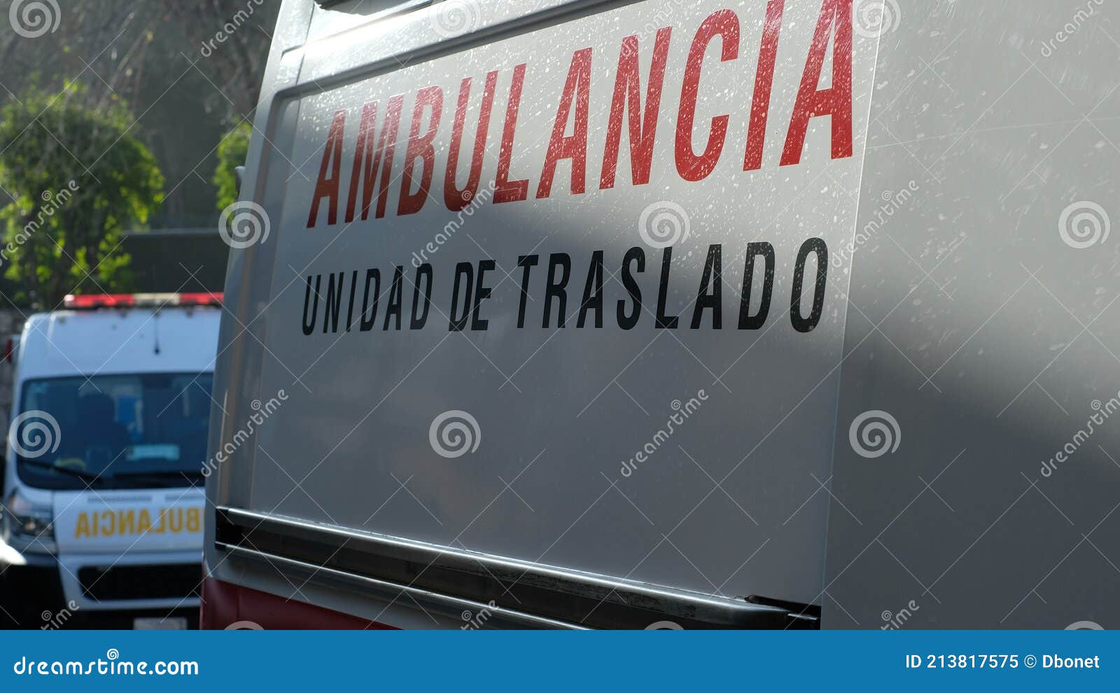 two ambulances in a row with the sign `ambulance transfer unit` in spanish