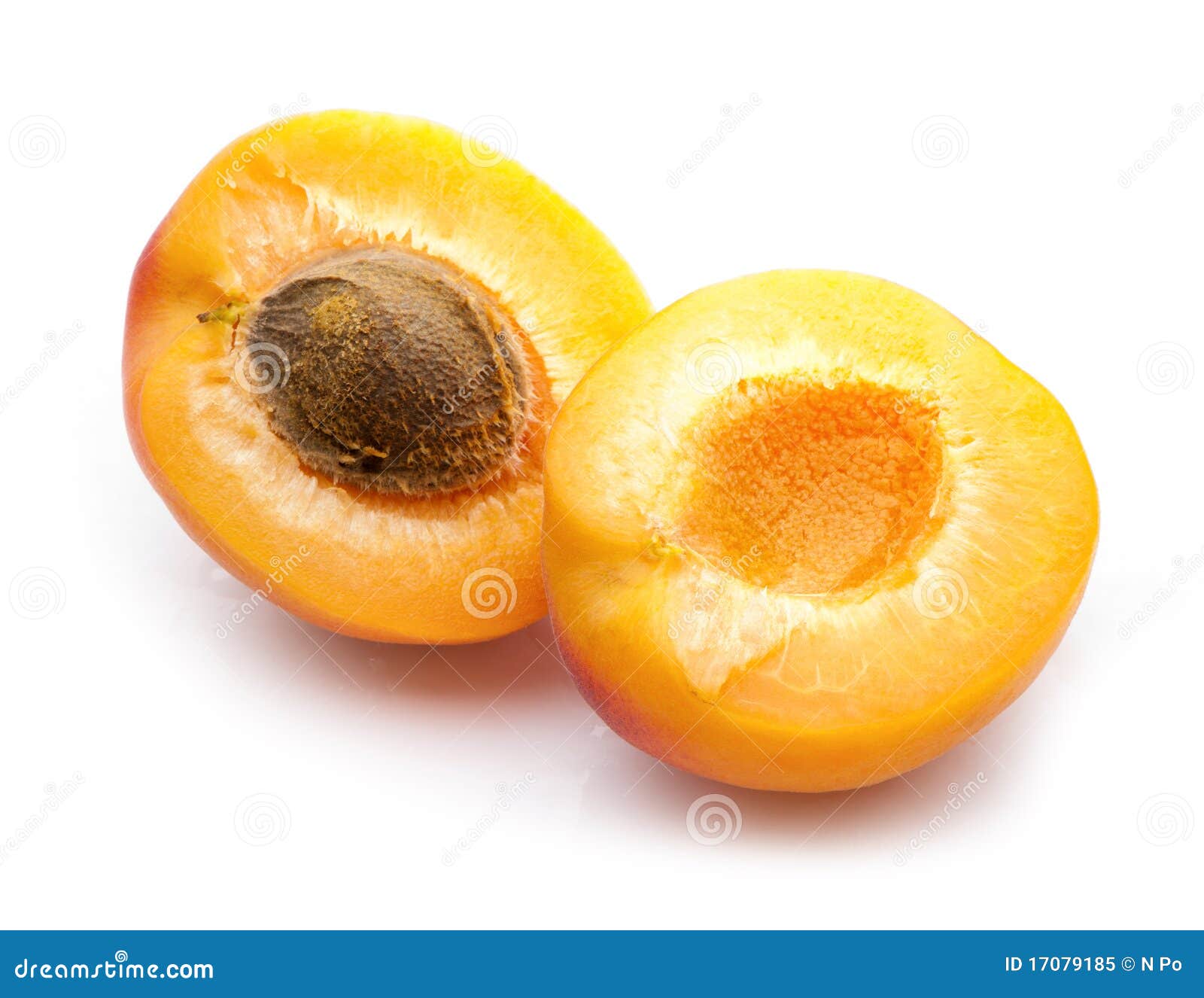two apricot halves with stone