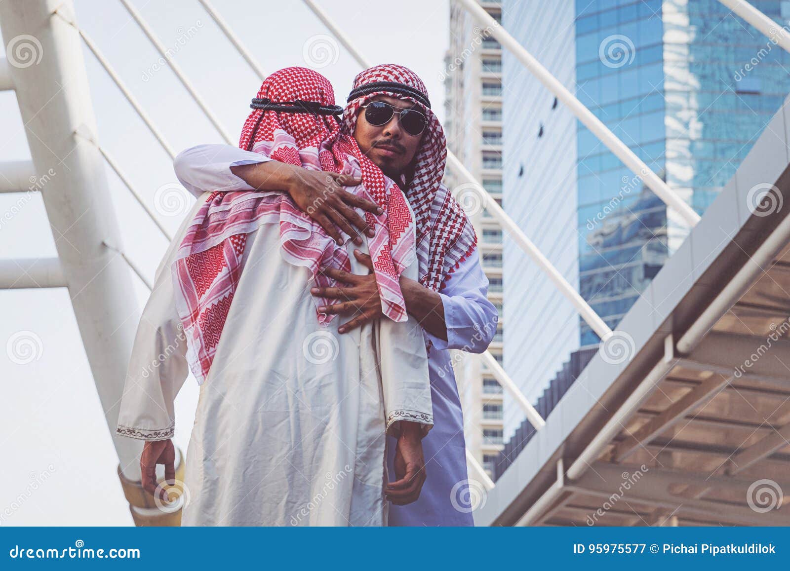 Two Arab Businessmen Greet with a Hug, on City Stock Image Image of