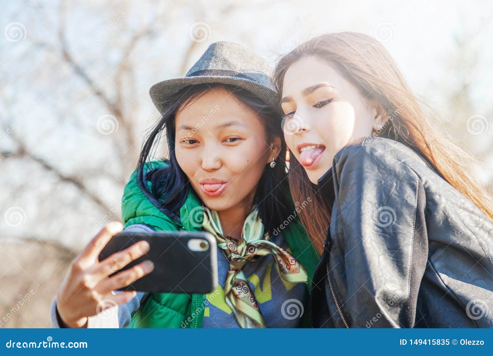 https://thumbs.dreamstime.com/z/two-asian-girlfriends-teen-girls-new-technology-trends-friendship-concept-trendy-making-video-story-social-network-app-149415835.jpg