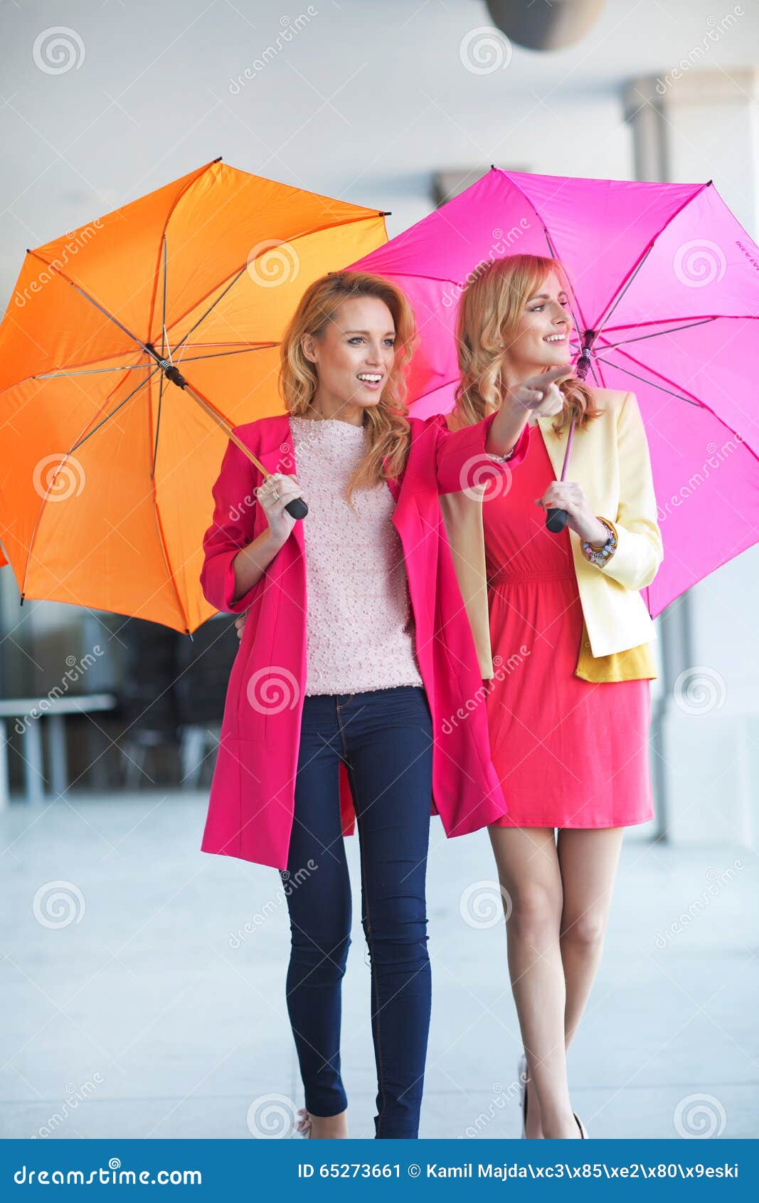 Two Attractive Friends Walking with Umbrellas Stock Image Image of