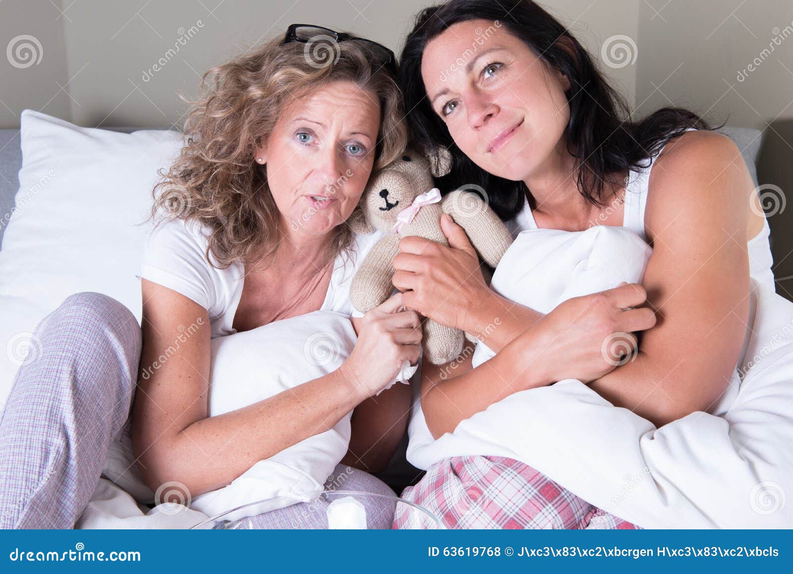 Two Attractive Women Sitting in Bed and Dreaming Stock Photo Image of friends, ager 63619768