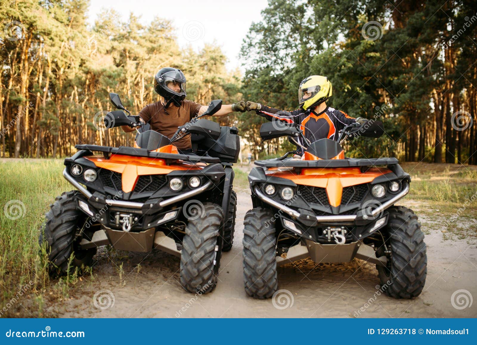 Two Atv Riders Hits Fists For Good Luck Back View Stock Photo Image Of Motocross Competition