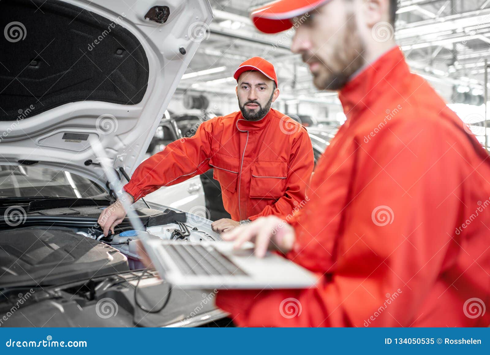 Auto Mechanics Doing Diagnostics with Laptop Stock Image Image of male, hood 134050535