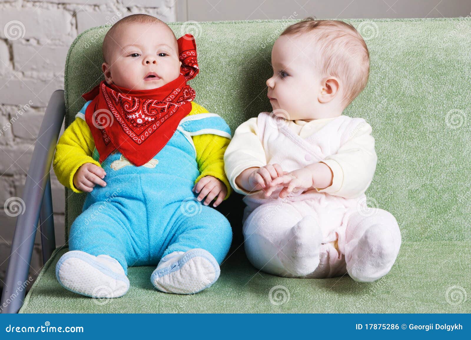 Two Babies Sitting on a Sofa Together Stock Photo Image of lovely, caucasian 17875286
