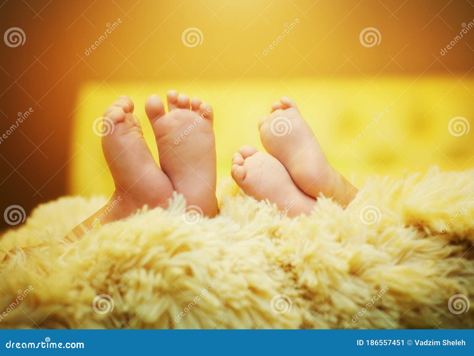 Two Babies are Sleeping on the Bed. Showing Off Her Legs Seductively Stock Image Image of