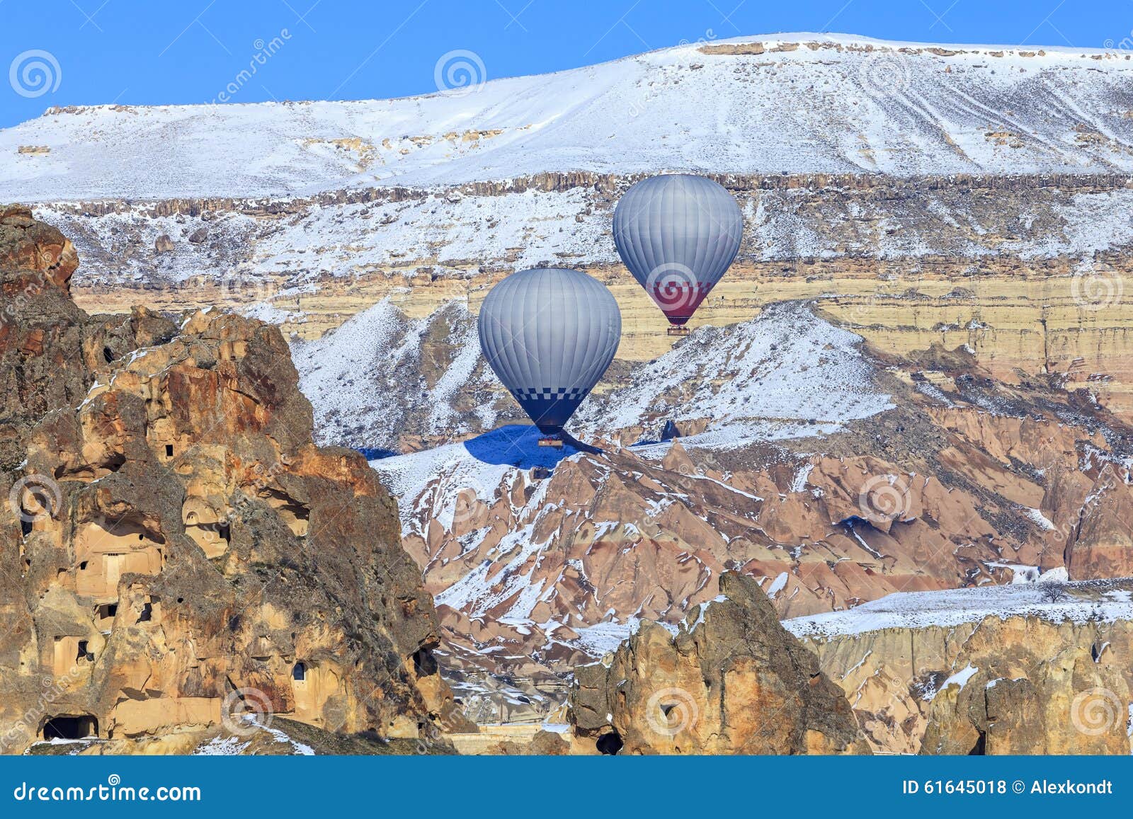 two balloons on a background of mountains of capadocia. turkey.