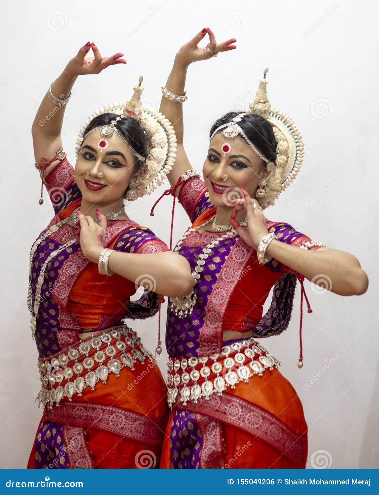 Two Beautiful Classical Odissi Dancers Performing Odissi Dance on Stage at Konark Temple, Odisha
