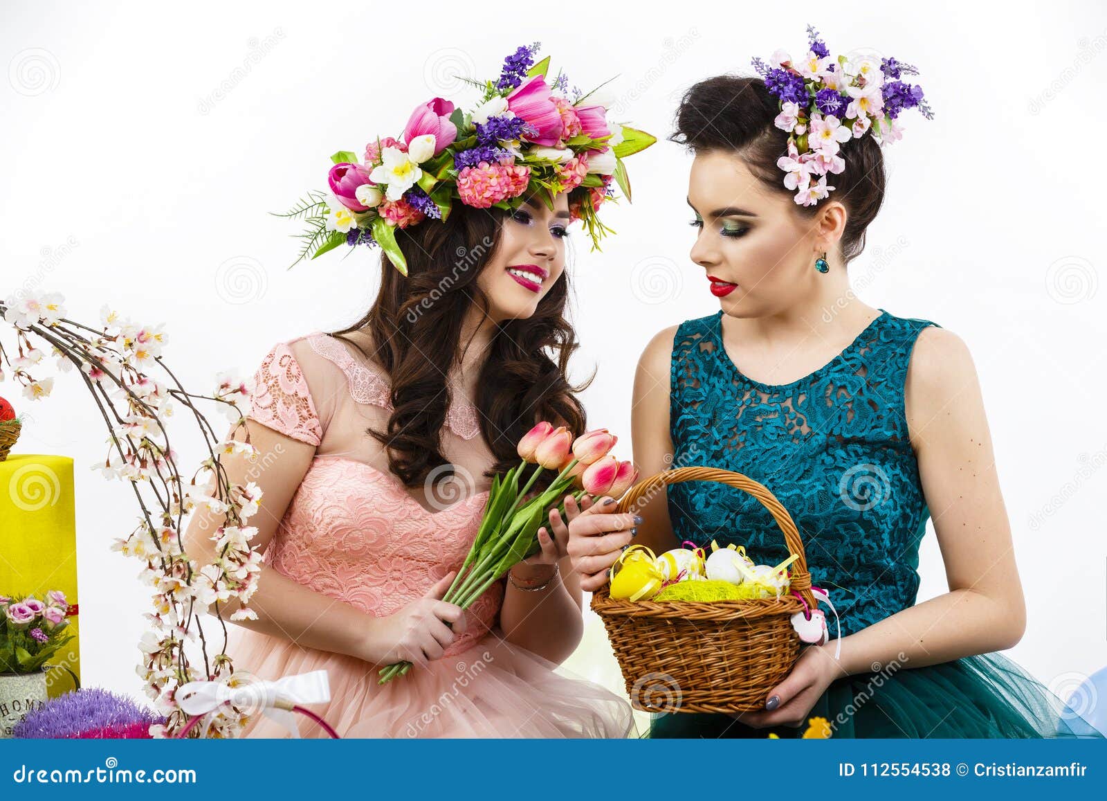 Easter girl holding bunny and eggs. Woman with holiday spring flowers  hairstyle and make up kissing rabbit . White background. Makeup with fake  eyelashes. Stock Photo | Adobe Stock