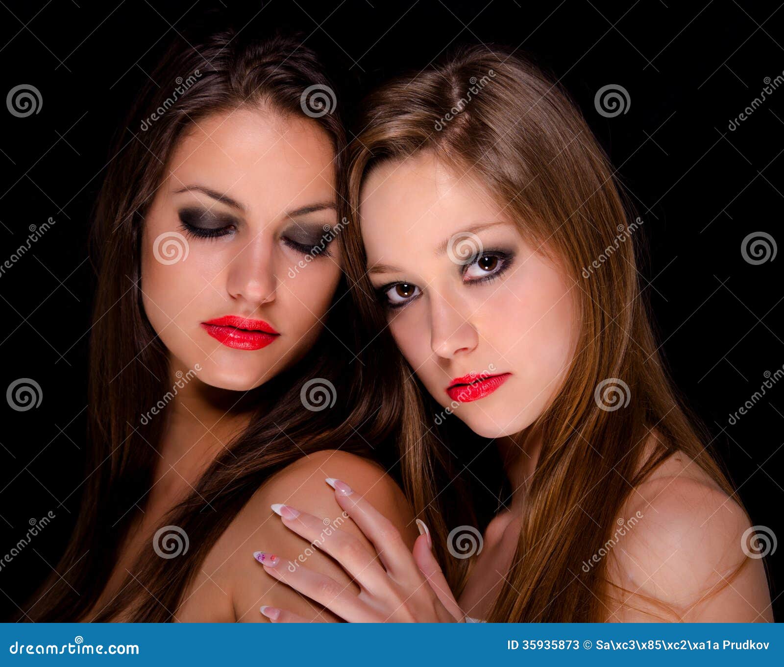 two beautiful girls being intimate