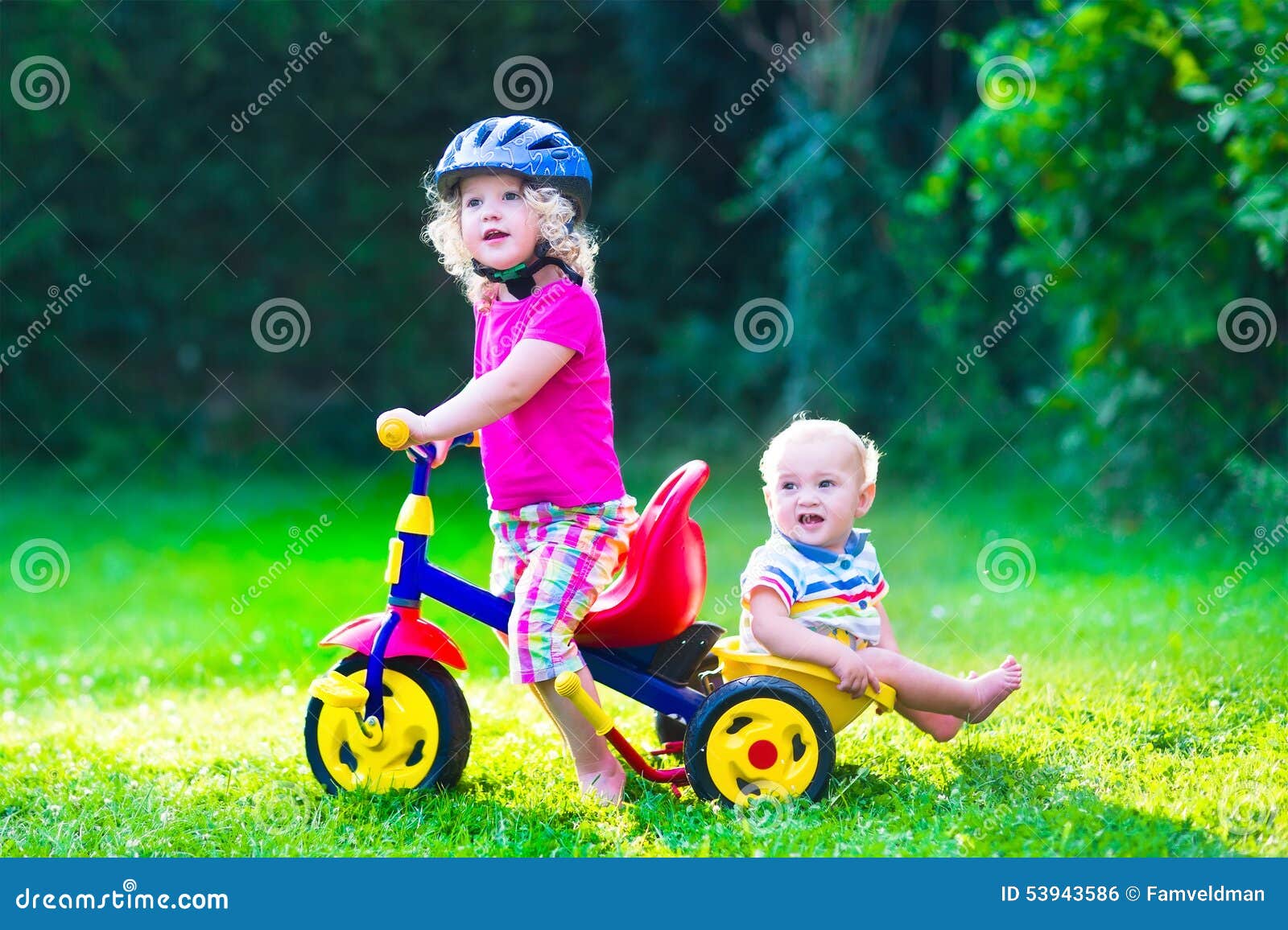 Two Beautiful Kids on a Bike Stock Photo - Image of backyard, girl ...