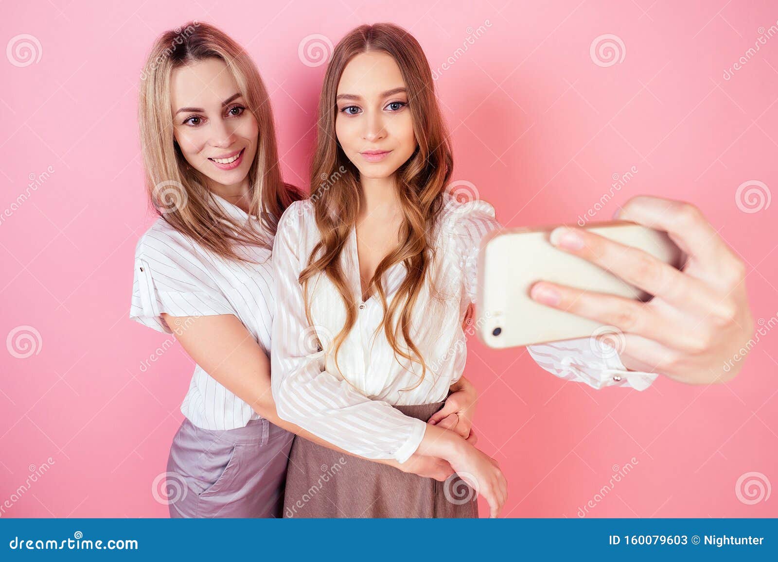 Two Beautiful and Smiling Female Persons Mother and Daughter Take ...