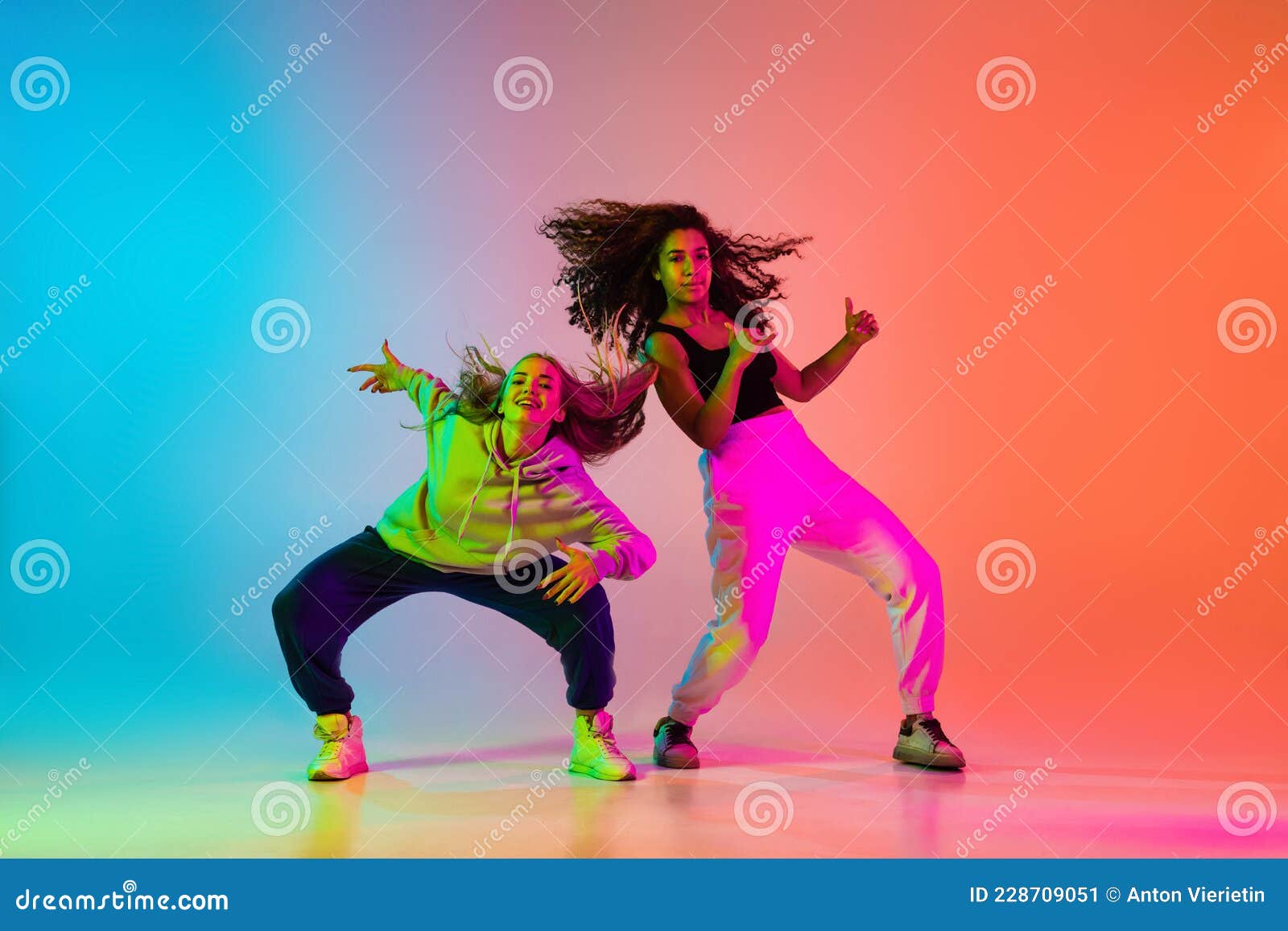 Two Beautiful Stylish Hip-hop Dancers on Colorful Gradient Background in  Neon Lights Stock Image - Image of electronic, costume: 228709051