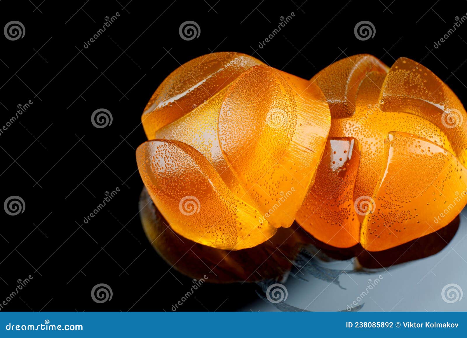 Two Beautiful Yellow Marmalade Candy on a Dark Background Stock Photo