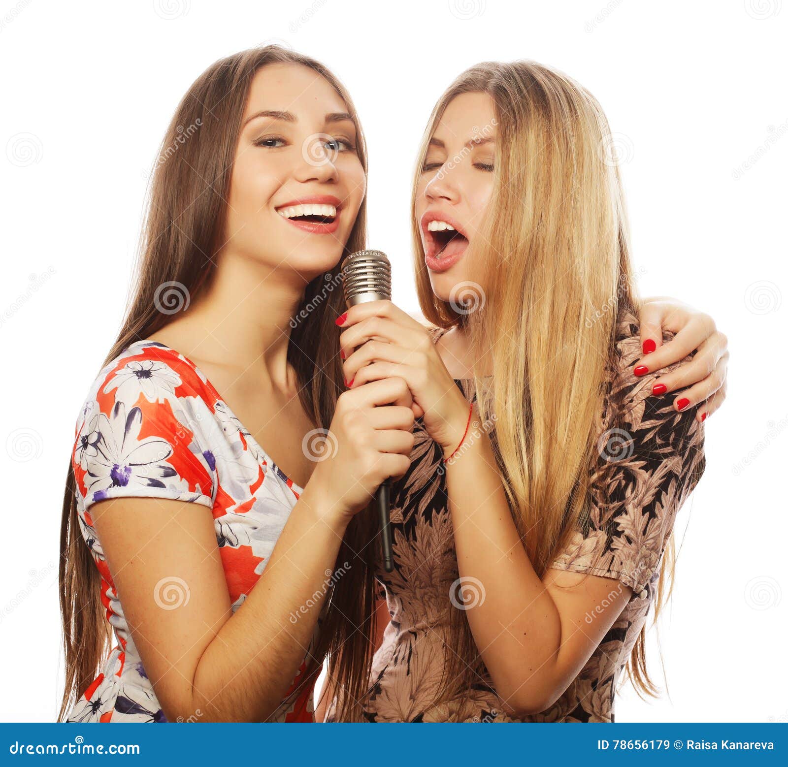 Two Beauty Girls With A Microphone Singing And Having Fun Stock Image