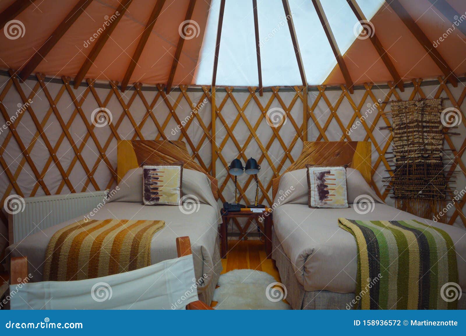 two beds in yurt on luxury glamping in chile