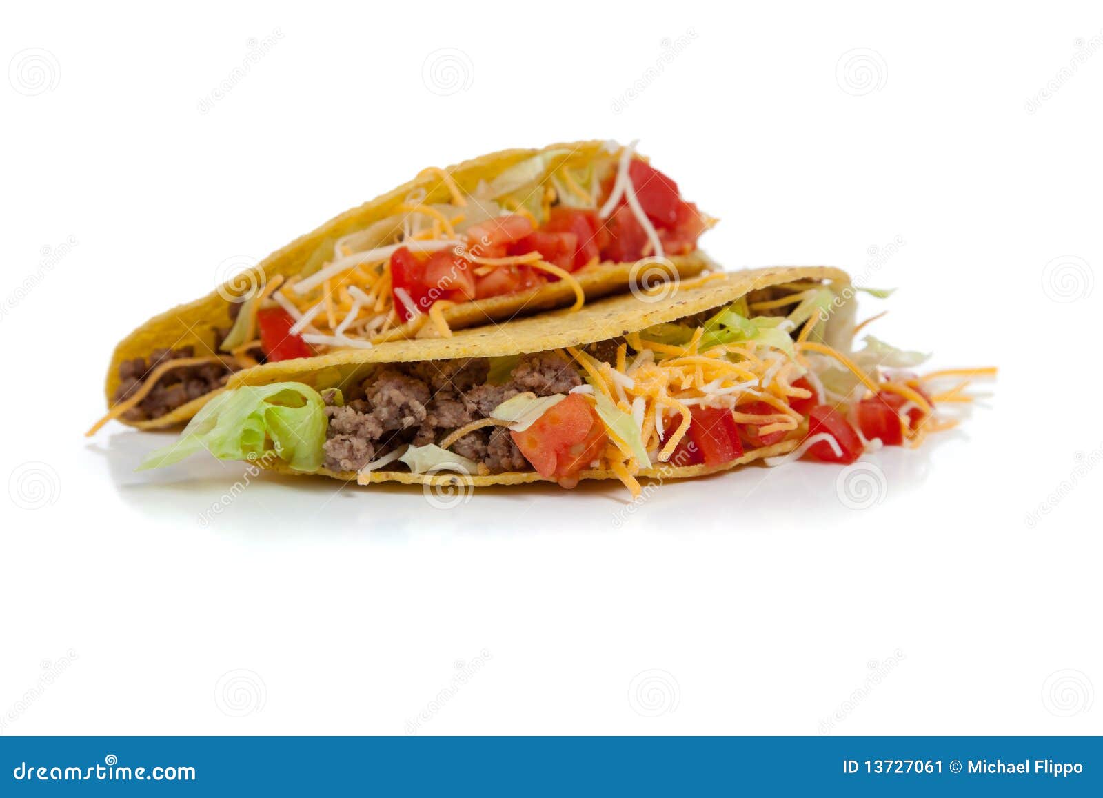 two beef tacos on white with copy space