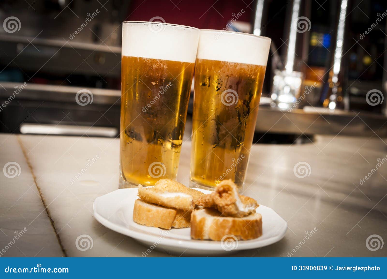 Two beers stock image. Image of amber, alcohol, food 33906839