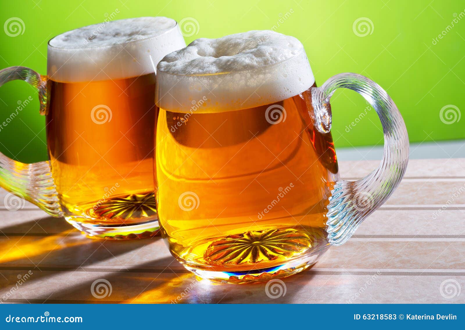 Two beers on the table stock image. Image of filled, full 63218583