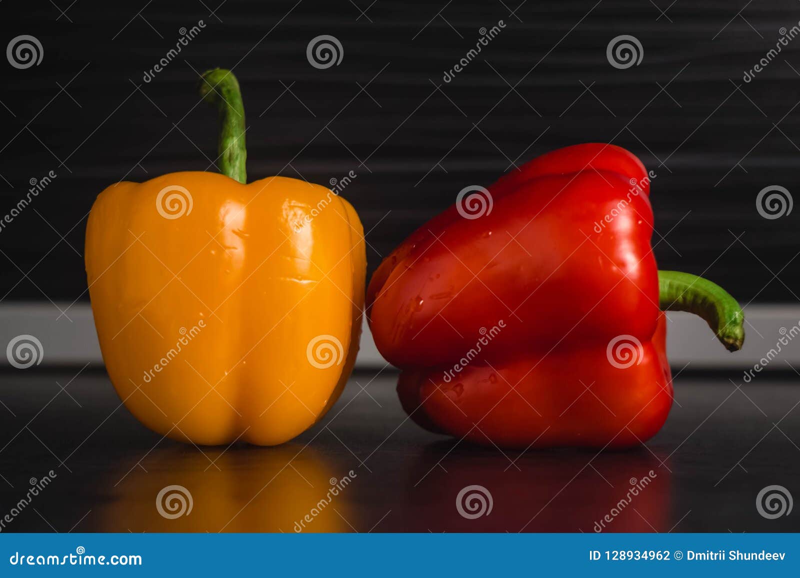 Two Bell Peppers on Modern Kitchen Blurry Background Stock Photo