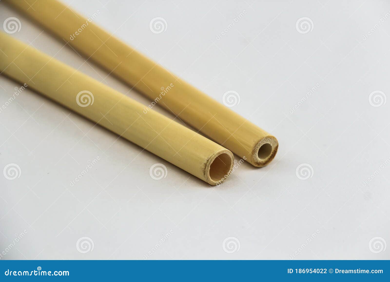 Two Biodegradable Bamboo Straws on a White Background. Environmentally