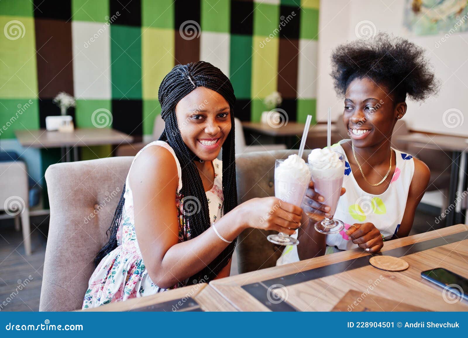 Two Black African Girlfriends At Summer Dresses Posed At Caf image