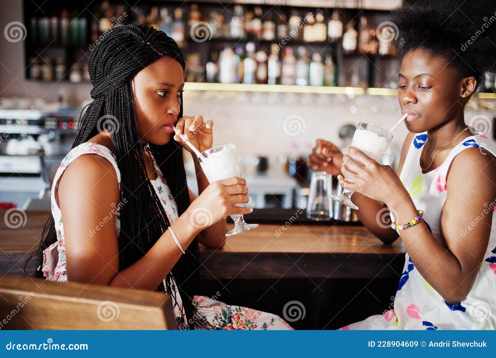 Two Black African Girlfriends at Summer Dresses Posed at Caf pic