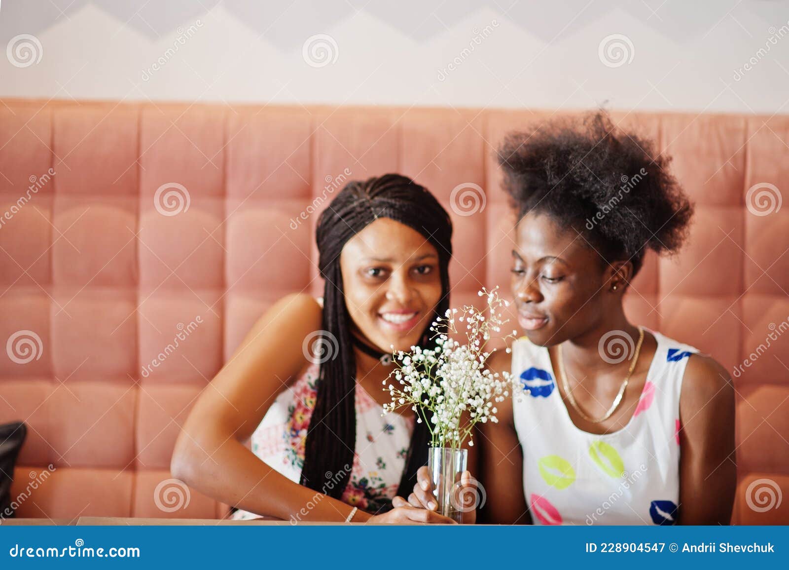 Two Black African Girlfriends at Summer Dresses Posed at Caf image