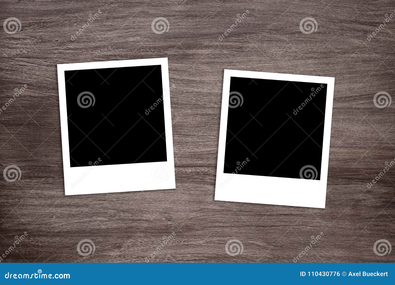 two blackened instant photo print templates on wooden background